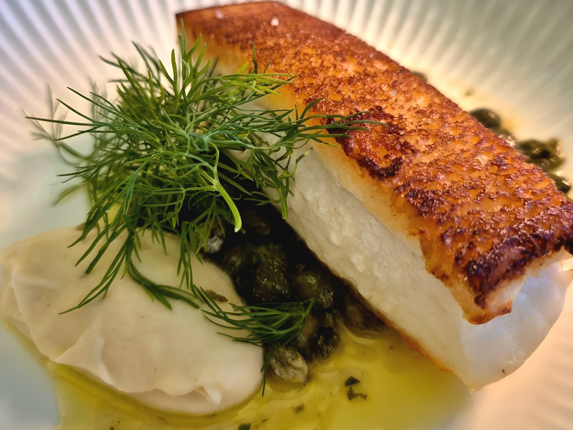 A pan-seared fish dish served for dinner in Copenhagen