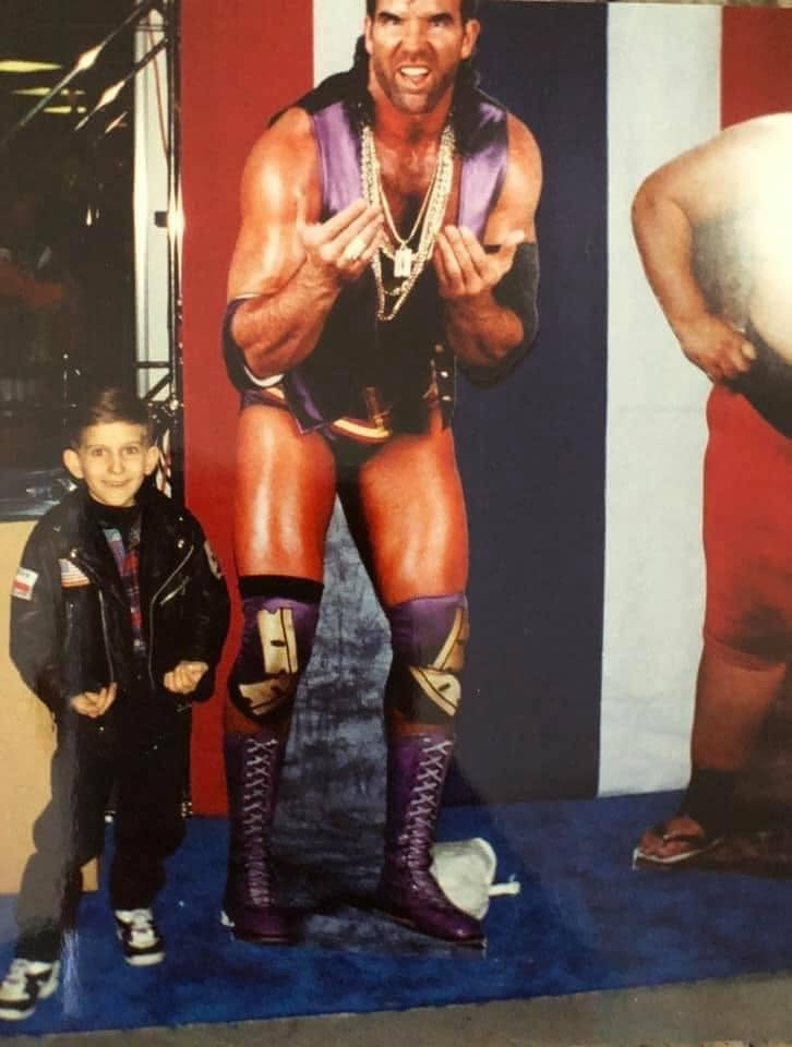 Young Greg next to a Razor Ramon WWE cutout