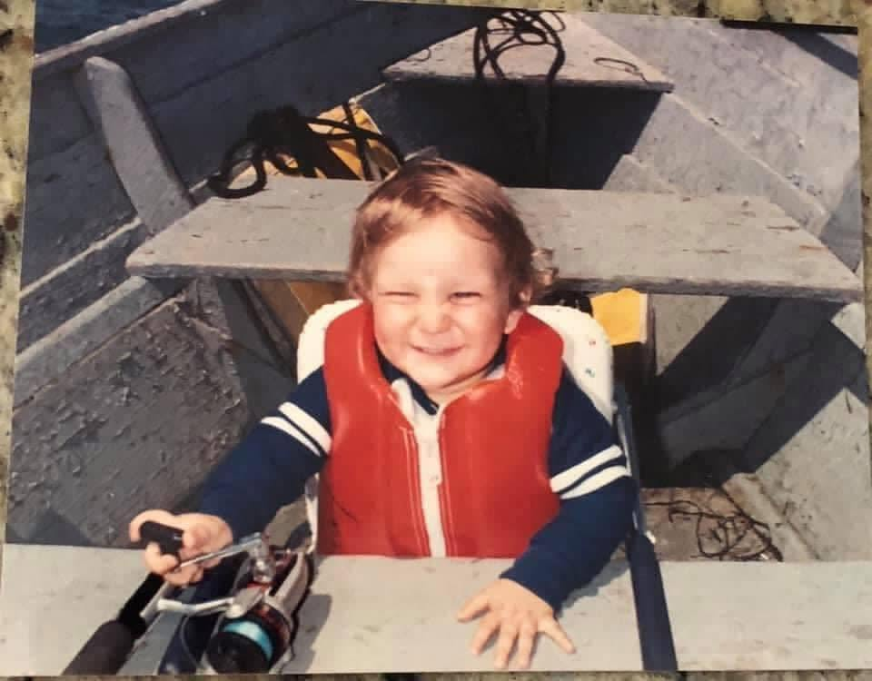 Young Greg fishing in the Hamptons with a life vest and rod