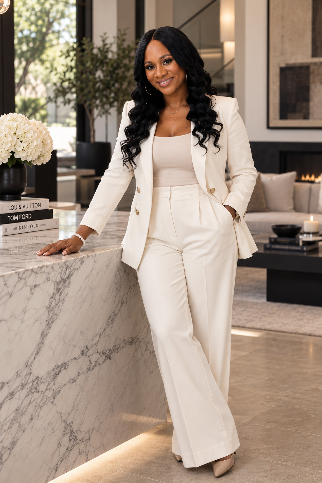 Shronda Ward in a white suit at a marble counter